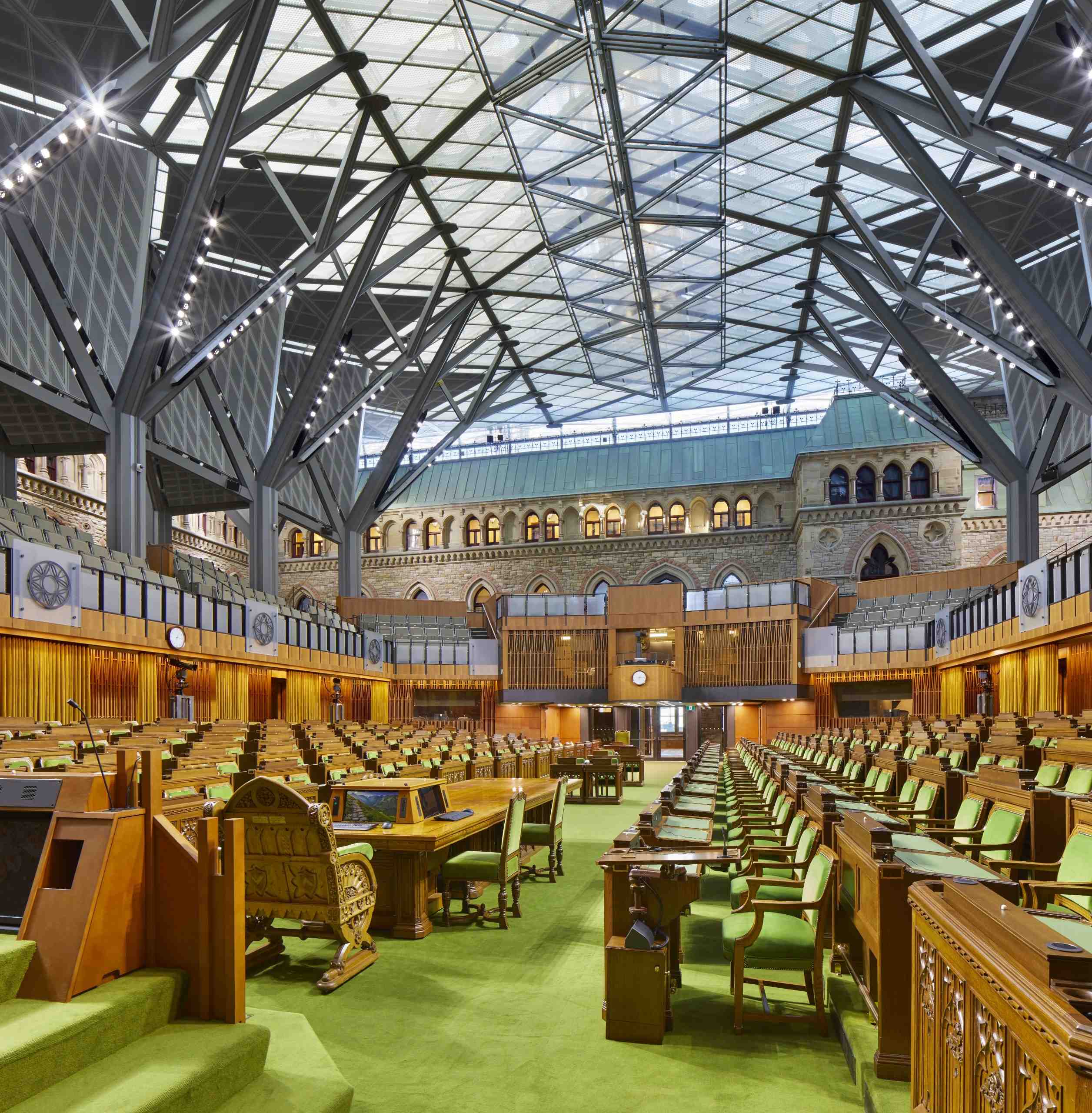 West block interior with the sun shining through the glass ceiling.